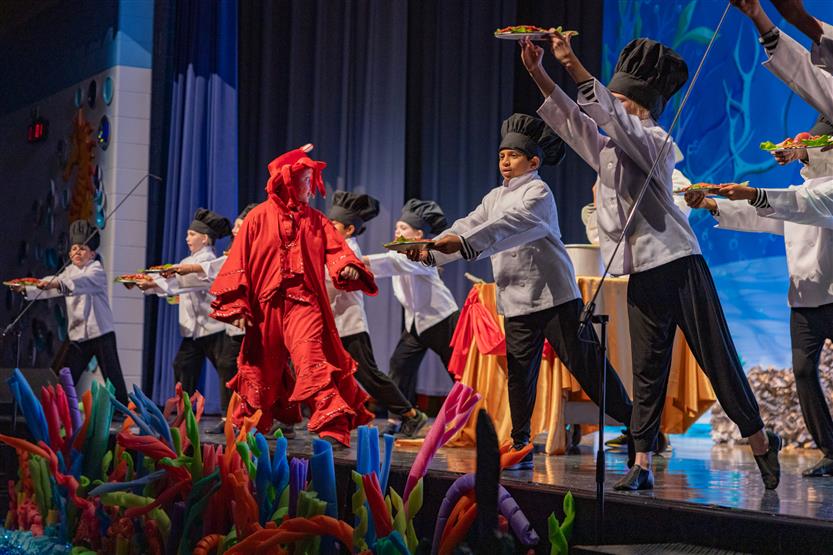 Students perform onstage